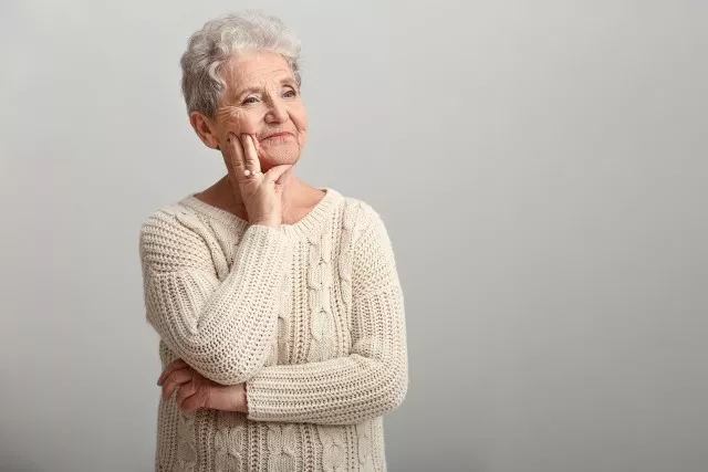 Portrait of senior woman on white background